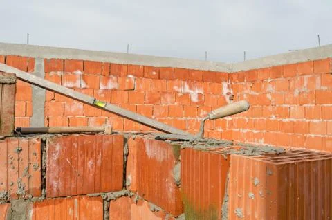 Construction site of clay bricks blocks home and tools 写真素材