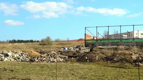 Construction site clearing and debris removal in a rural area during a sunny day Vídeos de archivo 332015329