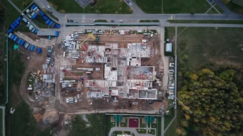 Construction site close to park zone time-lapse top down aerial Stock Footage 142946197