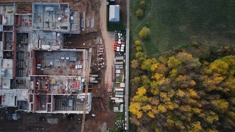 Construction site close to park zone time-lapse top down aerial Stock Footage 142946199