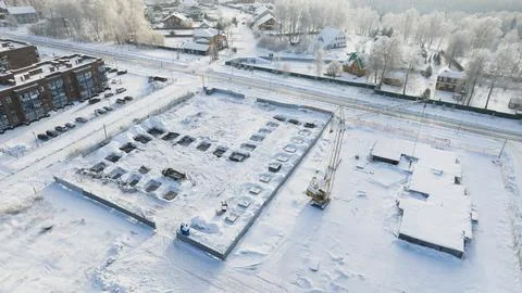 Construction site in cold snow winter. Foundation. Aerial view Stock Photos