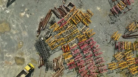 Construction Site with Colorful Metal Frames and Heavy Machinery in Urban Stock Footage 316450742