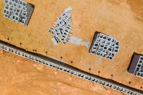 Construction site with concrete blocks groundwork preparation in suburban area Stock Photos