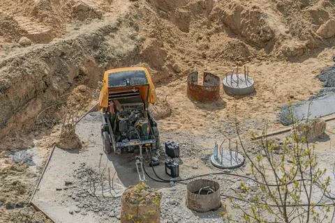 Construction Site with Concrete Pump and Foundation Work in Progress 写真素材