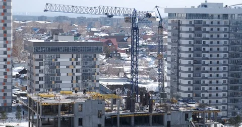 Construction site, construction of new apartment building, high-rise, crane work Stock Footage 128972321