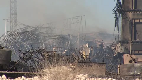 Construction site continuing to smolder 24 hours after initial fire call Stock Footage 245278627