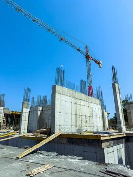 Construction site with crane and concrete structures under construction in .. Stock Photos