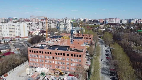 Construction site with crane and school building Stock Footage 159242380