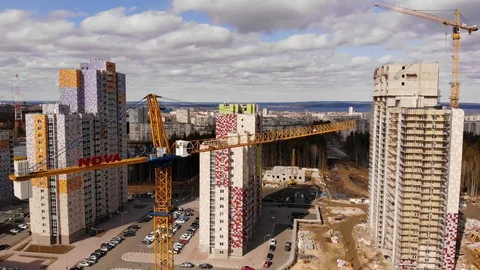 Construction site with crane and workers building flat house. Stock Footage 128455744