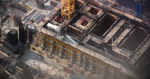 Construction site with crane and workers in Dubai, tilt shift timelapse Stock Footage 340476899