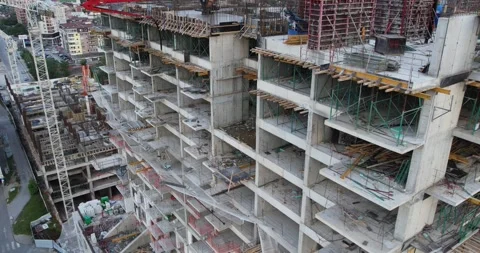 A construction site with a crane in the background. The crane is lifting a la Stock Footage 344916027