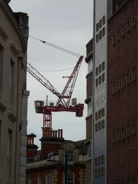 Construction Site Crane Between Buildings Stock Photos
