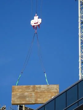 Construction Site Crane Hook Lifting A Load Stock Photos