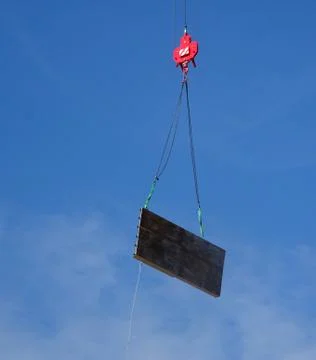 Construction Site Crane Hook Lifting A Load Stock Photos