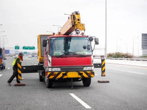 Construction site crane is lifting a led signboard for advertisement Foto stock