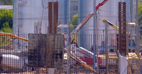 At a construction site, the crane lowers the formwork for the wall Stock Footage 162017623