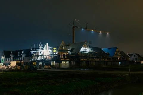 Construction Site with Crane at Night Stock Photos