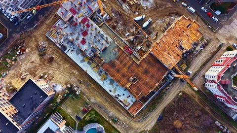 Construction site with cranes and building structures in a city during daylight Vídeos de archivo 332032029