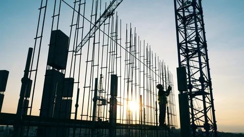 Construction site with cranes and the engineer working with metal Stock Footage 118573638
