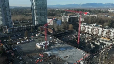 A Construction Site With Cranes and a High-rise Building Stands Amid 스톡 동영상 331033508