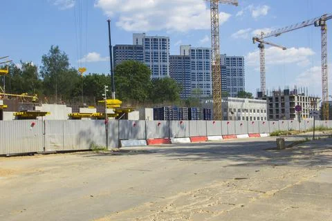 Construction site with cranes. Construction site with a blue sky Stock Photos