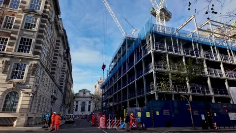 Construction site with cranes on Dean Stanley Street in Westminster London UK Stock Footage 321899451