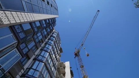 Construction site with cranes on sky background Video stock 72779175