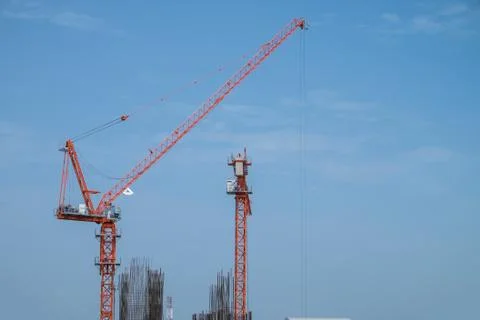 Construction site with cranes on sky background Stock Photos
