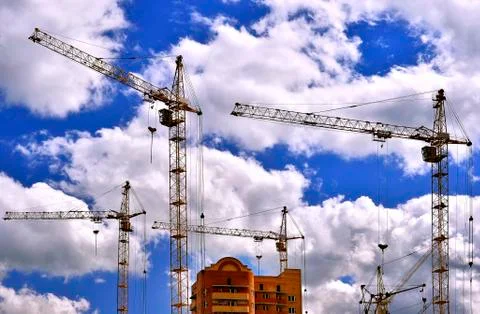 Construction site with cranes on sky background Stock Photos