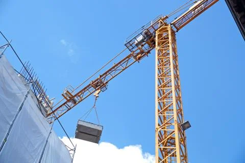 Construction site with cranes on sky background Stock Photos