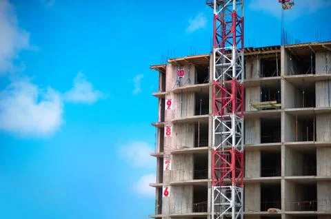 Construction site with cranes on sky background Stock Photos