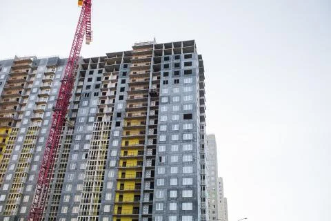 Construction site with cranes on sky background Фото