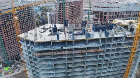 Construction site with cranes at sunset. Construction of an apartment building. Stock Footage 142634608