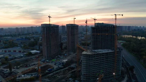 Construction site with cranes at sunset. Construction of an apartment building. Stock Footage 205196849