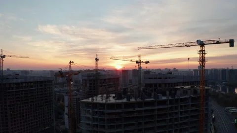 Construction site with cranes at sunset. Construction of an apartment building. Stock Footage 205197716