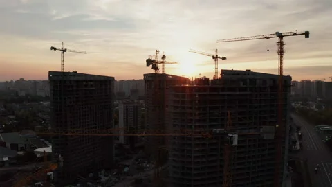 Construction site with cranes at sunset. Construction of an apartment building. Stock Footage 205198448