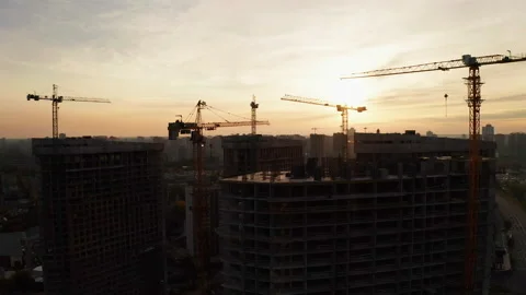 Construction site with cranes at sunset. Construction of an apartment building. Stock Footage 205199376