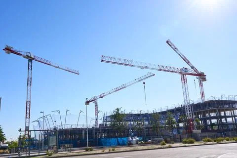 Construction site with cranes under a clear blue sky in Madrid Stock-Fotos