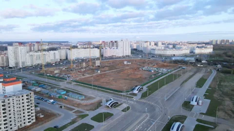 Construction site at dawn. Claimed multi-storey houses are visible. Construction Stock Footage 152978017