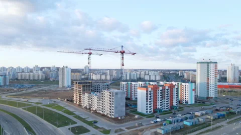 Construction site at dawn. Claimed multi-storey houses are visible. Construction Stock Footage 152978307