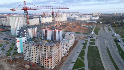 Construction site at dawn. Claimed multi-storey houses are visible. Construction Stock Footage 152978708