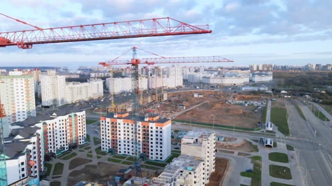 Construction site at dawn. Claimed multi-storey houses are visible. Construction Stock Footage 152979058