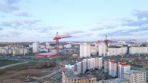Construction site at dawn. Claimed multi-storey houses are visible. Construction Stock Footage 152979440