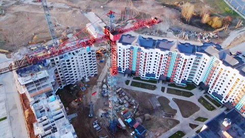 Construction site at dawn. Claimed multi-storey houses are visible. Construction Stock Footage 152979542