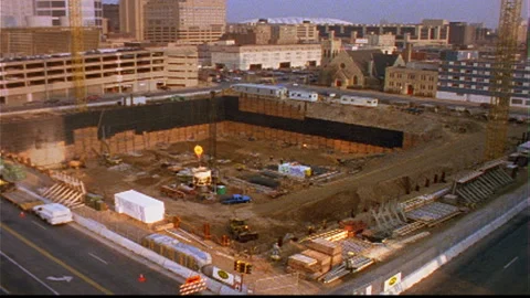 Construction Site deep hole -cement bucket lowered Stock Footage 145617290
