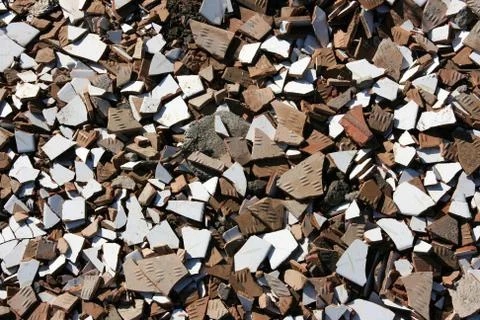Construction site detail background. Broken bathroom tile pieces. Stock Photos