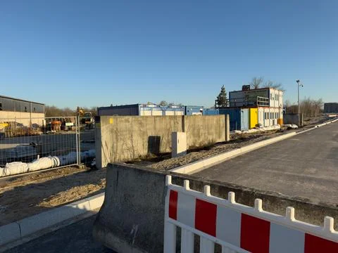 Construction site development with shipping containers and new road Stock Photos