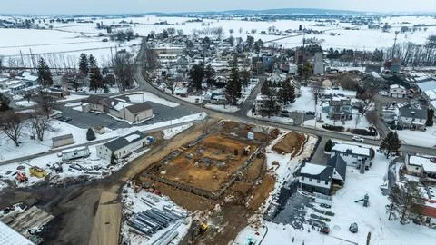 Construction Site Development in Winter Landscape With Town View Stock Photos