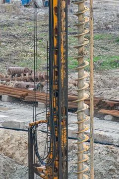 Construction Site with Drilling Rig and Worker Foto stock