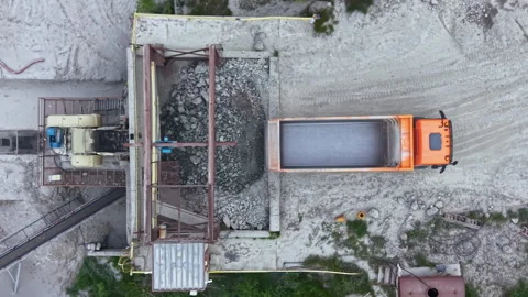 Construction site with dump truck unloading materials at gravel processing plant Stock Footage 340179273
